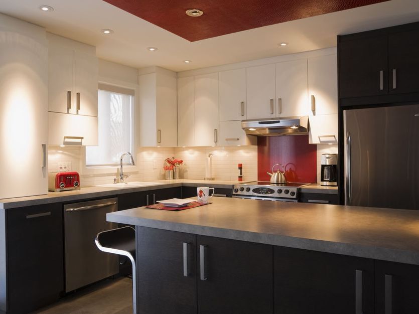 Electricians Wiring Up The Futuristic Kitchen